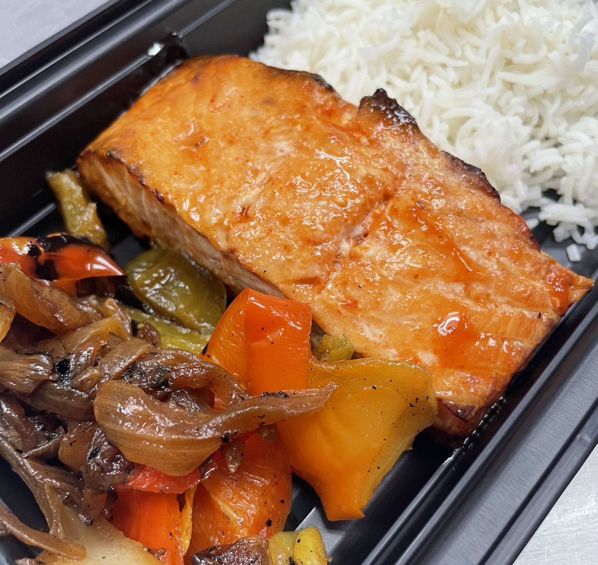 11. Honey Sriracha Salmon with Peppers & Onions over White Rice